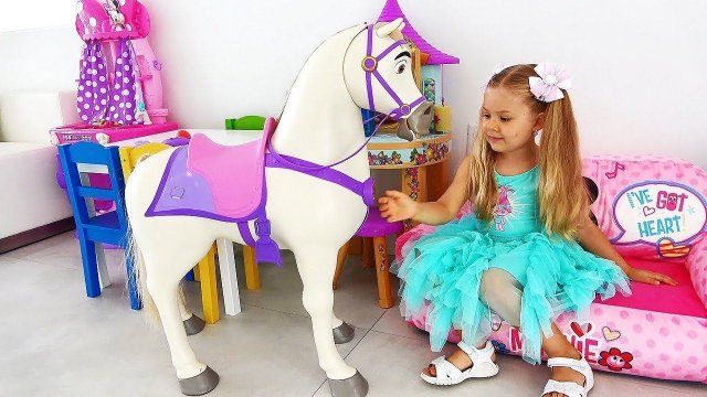 Diana playing with Disney Princess Rapunzel Doll